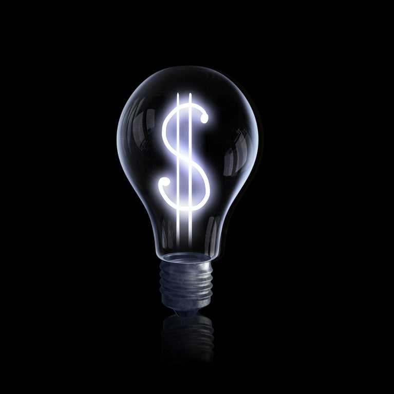  Light bulb with dollar symbol on dark background
